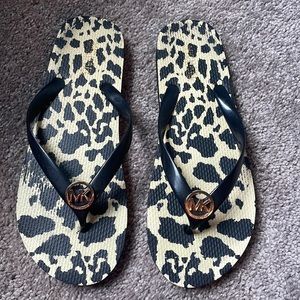 Michael Kors Flip Flops, Size 10. Gently used. Black and animal print.